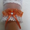 Подвязка невесты бело-оранжевая